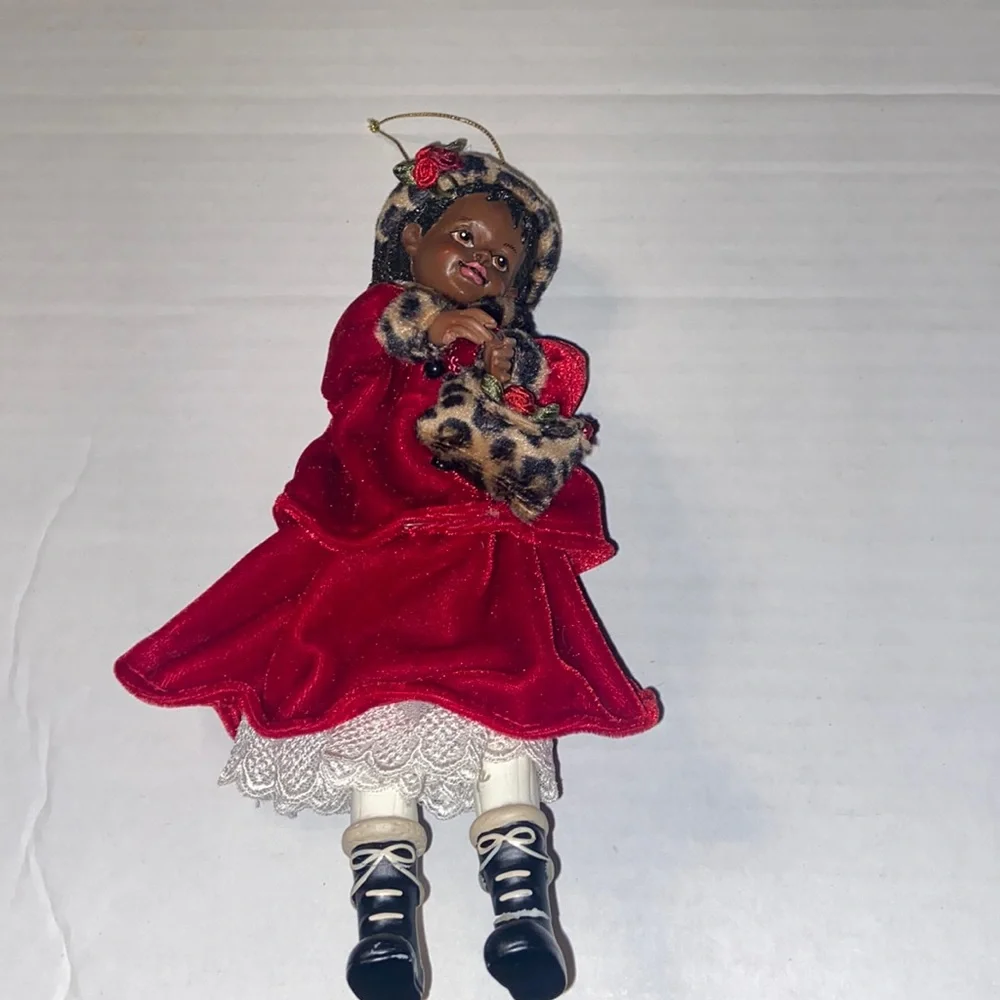 Vintage African American doll ornament with red velvet and leopard fur purse